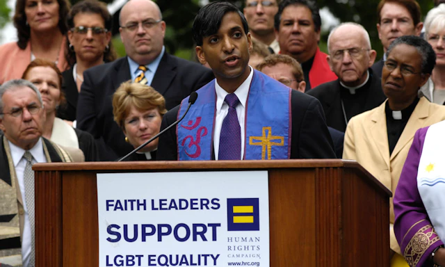 Group photo of faith leaders with one speaking behind a podium with a sign that reads "Faith leaders support LGBTQ Equality" with the HRC equality logo on it.