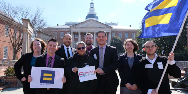 People standing in front of Maryland government building
